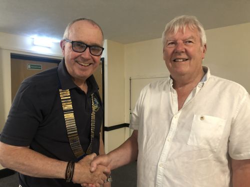 Immediate Past President Malcolm Luxton hands over the President's chain of office to Lion Peter Stonely Immediate Past President Malcolm Luxton hands over the President's chain of office to Lion Peter Stonely
